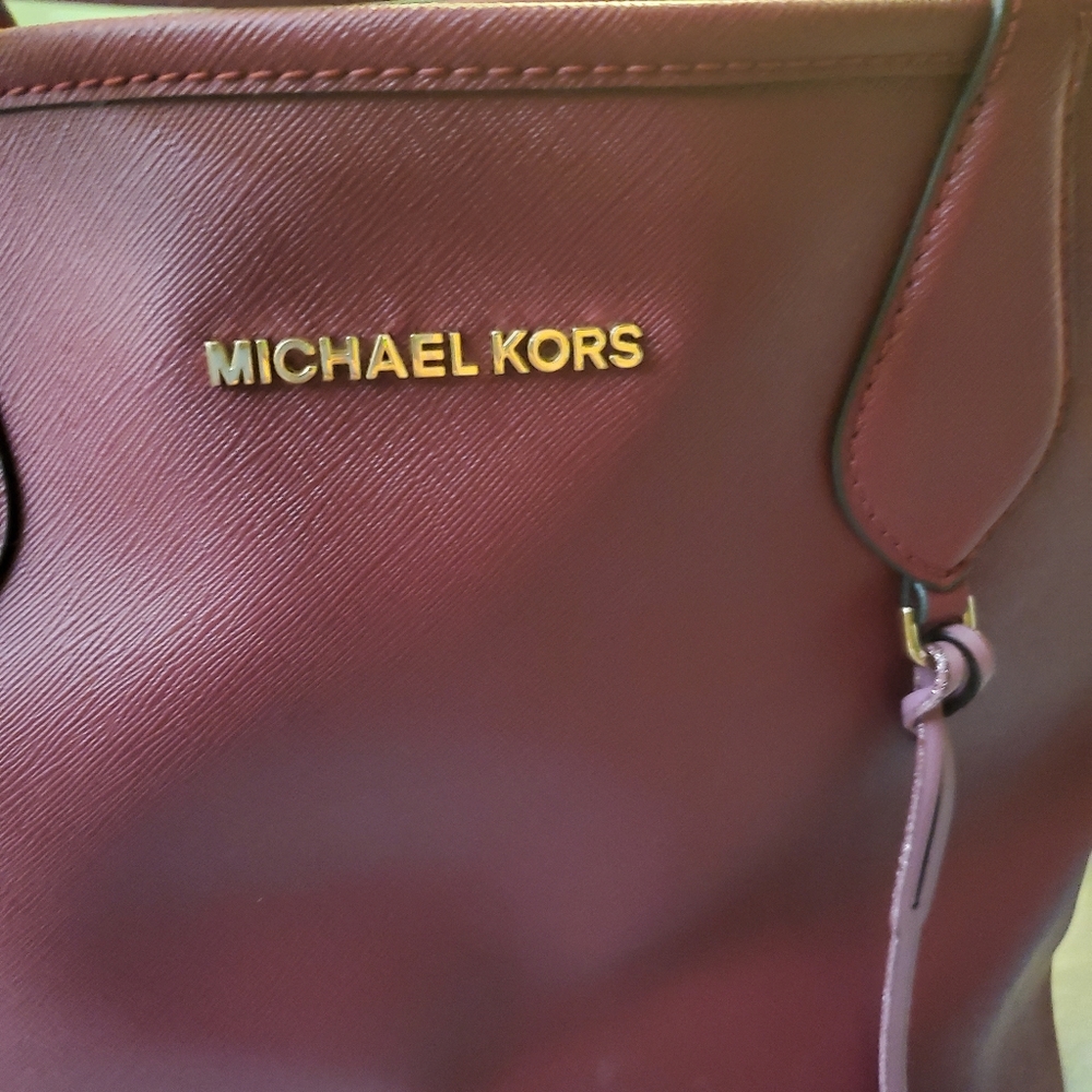 Mk tote and the other bag is free.